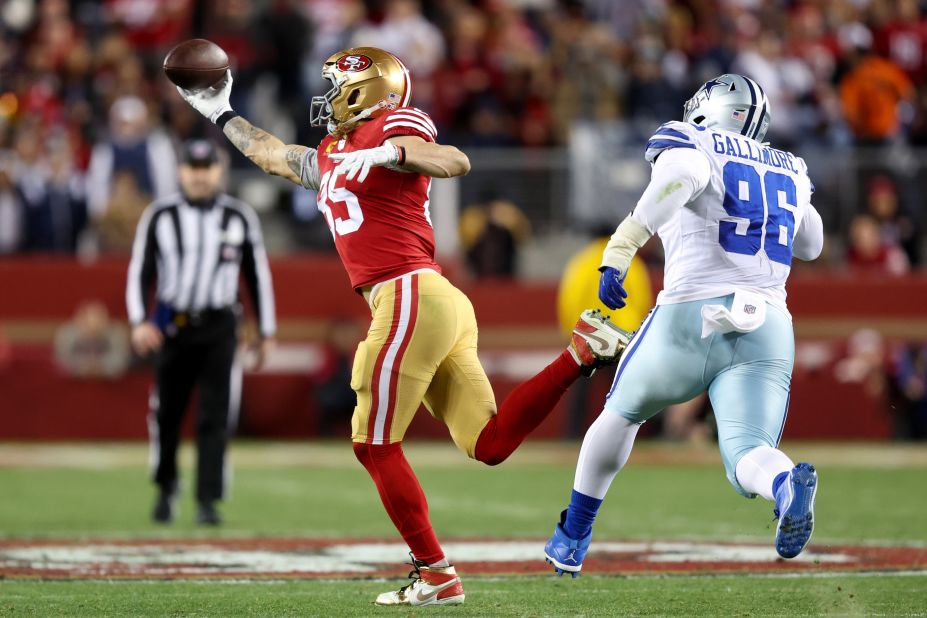 George Kittle of the San Francisco 49ers catches a pass against the Dallas Cowboys during the third quarter. The 49ers' defense -- which picked off Cowboys quarterback Dak Prescott twice -- helped stymie Dallas in a 19-12 victory to move San Francisco to the NFC Championship game.