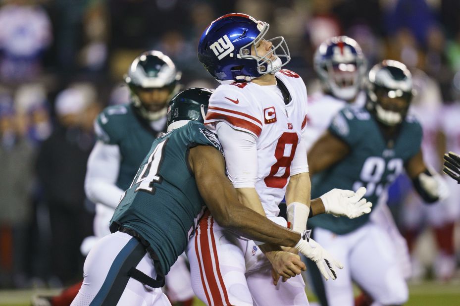 New York Giants quarterback Daniel Jones loses the ball while under pressure by Philadelphia Eagles defensive end Josh Sweat. The Eagles thoroughly dominated the Giants, winning 38-7, to advance to play the 49ers in the NFC Championship game. 