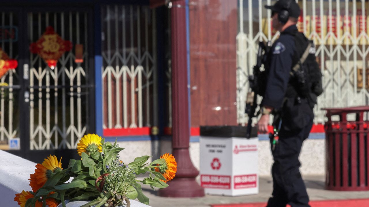 Flowers are seen near the location of a mass shooting that took place in Monterey Park, California.