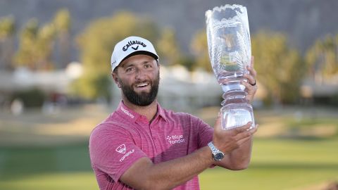 Jon Rahm holds The American Express trophy after victory at the Pete Dye Stadium Course in La Quinta, California.