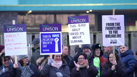 Ambulance workers stand on the picket line outside Aintree University Hospital in Liverpool on Monday, January 23. More strikes are planned for the weeks ahead.