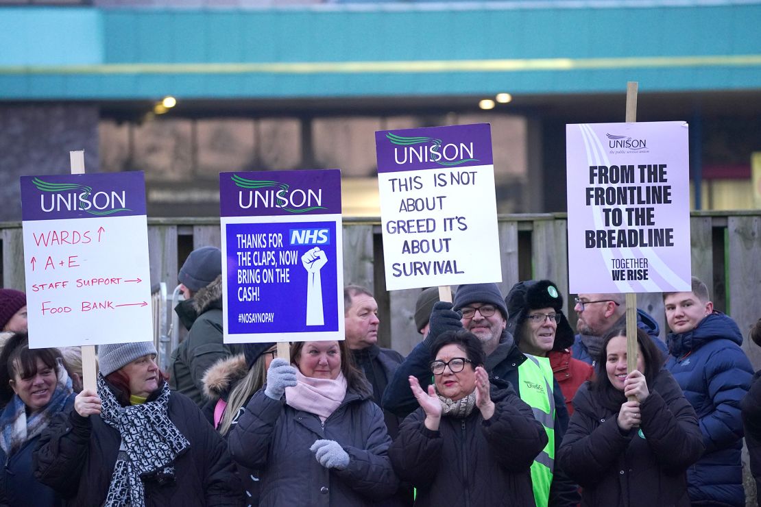 Ambulance workers stand on the picket line outside Aintree University Hospital in Liverpool on Monday, January 23. More strikes are planned for the weeks ahead.