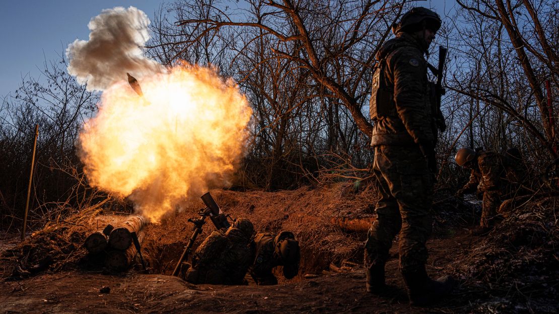Ukrainian servicemen fire a 120mm mortar towards Russian positions at the frontline near Bakhmut, Donetsk region, Ukraine, Wednesday, Jan. 11, 2023. 