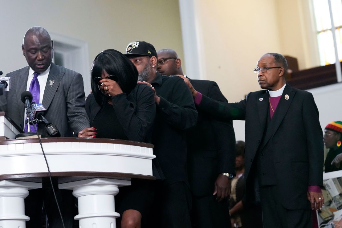 The mother of Tyre Nichols cries as she is comforted by Nichols' stepfather at a news conference in Memphis Monday. 