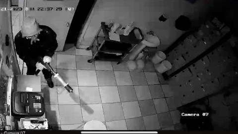 Security footage shows the suspect entering through a door. 