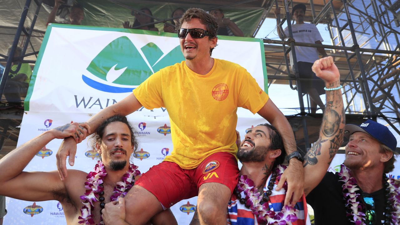 Luke Shepardson is congratulated by fellow surfers Landon McNamara (left) and Billy Kemper after winning the Eddie Aikau Big Wave Invitational at Waimea Bay.
