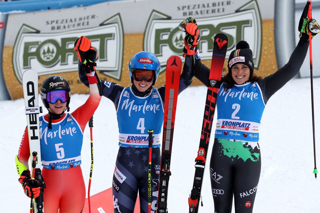 Shiffrin (center) celebrates her giant slalom victory at Kronplatz with second-placed Lara Gut-Behrami (left) and Federica Brignone (right).