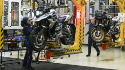19 December 2022, Berlin: Trainees Kevser (l) and Samantha work on the production line for motorcycles at the motorcycle plant in Spandau. Photo: Jens Kalaene/dpa (Photo by Jens Kalaene/picture alliance via Getty Images)
