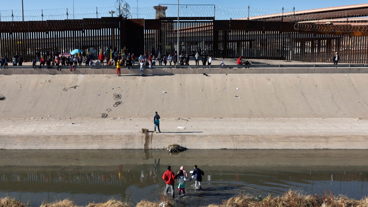 Immigrants cross the Rio Grande into El Paso, Texas, on January 8, 2023 from Ciudad Juarez, Mexico. 
