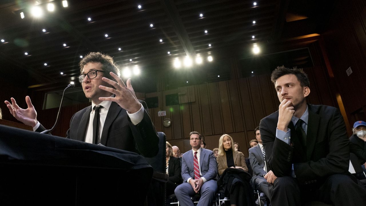 Bandmate Jordan Cohen, right, listens as singer-songwriter Clyde Lawrence, left, testifies before a Senate Judiciary Committee hearing to examine promoting competition and protecting consumers in live entertainment.