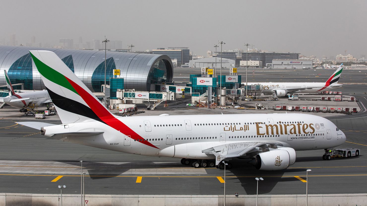 An Airbus A380 operated by Emirates taxis past the terminal at Dubai International Airport in March 2020. 