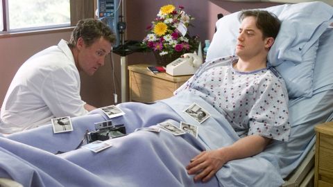 SCRUBS -- "My Hero" Episode 23 -- Aired 05/14/02 -- Pictured: (l-r) John C. McGinley as Dr. Perry Cox, Brendan Fraser as Ben Sullivan  (Photo by Paul Drinkwater/NBCU Photo Bank/NBCUniversal via Getty Images via Getty Images)