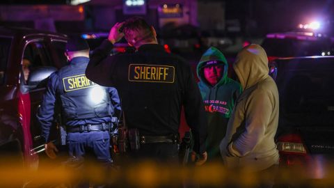 Sheriff's deputies direct with of us on the scene of a lethal shooting in Half of Moon Bay Monday.