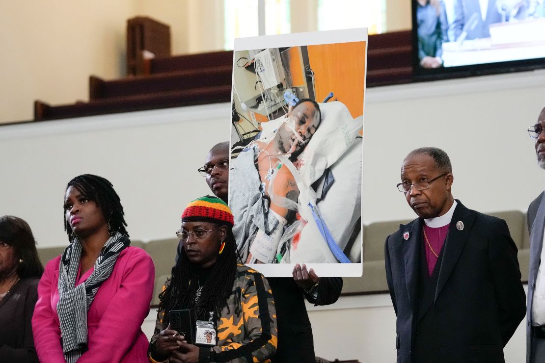 Family members and supporters hold a photograph of Tyre Nichols at a news conference in Memphis, Tennessee, Monday.