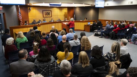 Community members pack into the Newport News Public Schools Administration building on January 17 in Newport News, Virgina, during a public comment period. 