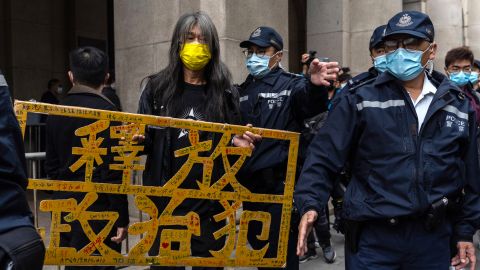 Activist Leung Kwok-hung holds a placard that says 