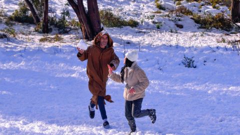 People play in the snow in Algeria's Constantine province, 400 kilometers east of the capital Algiers, on Monday.