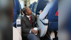 delta flight attendant comforts passenger 0125