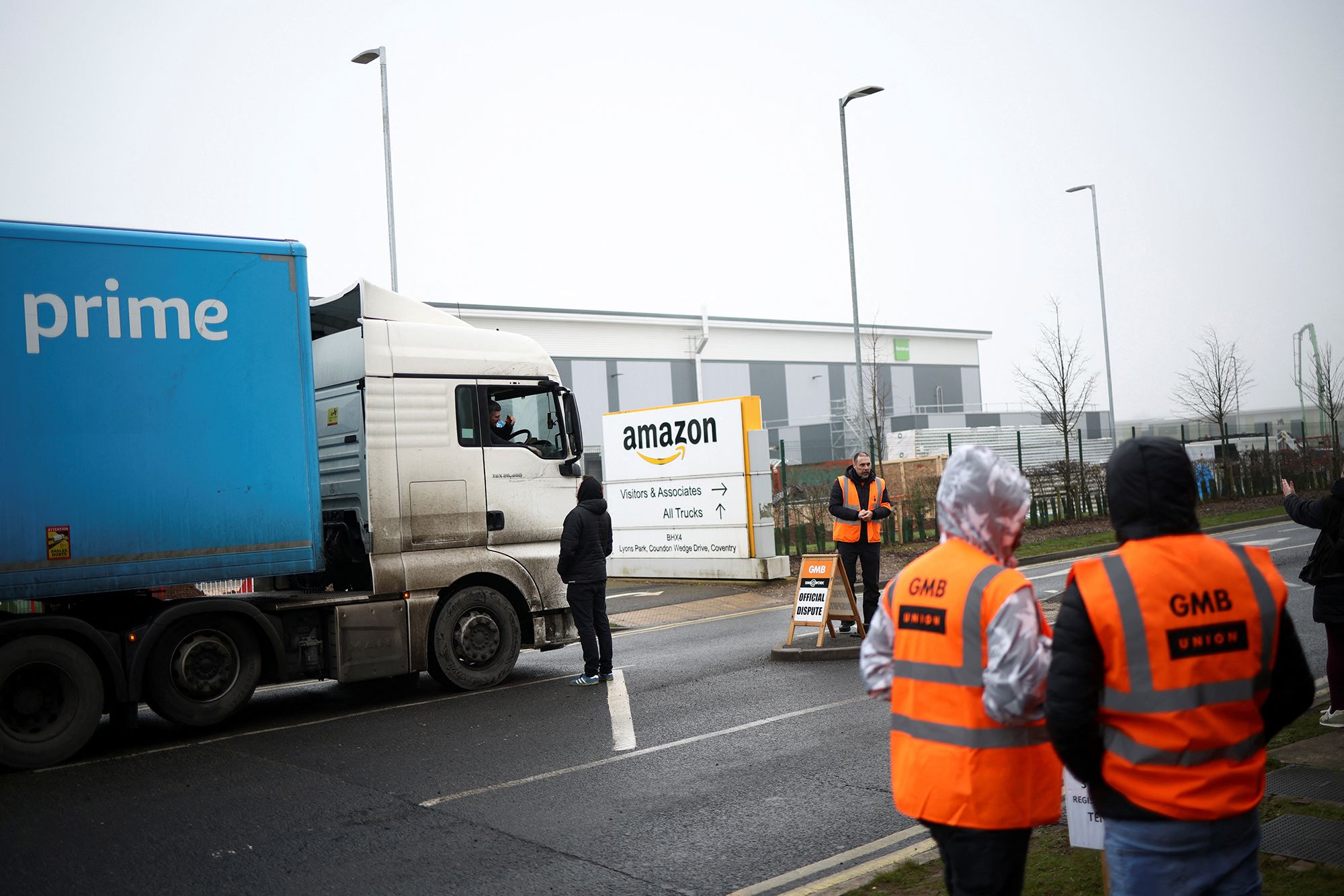 Amazon workers at a warehouse in central England went on strike Wednesday, the first time employees of the US tech giant have walked out in the country.