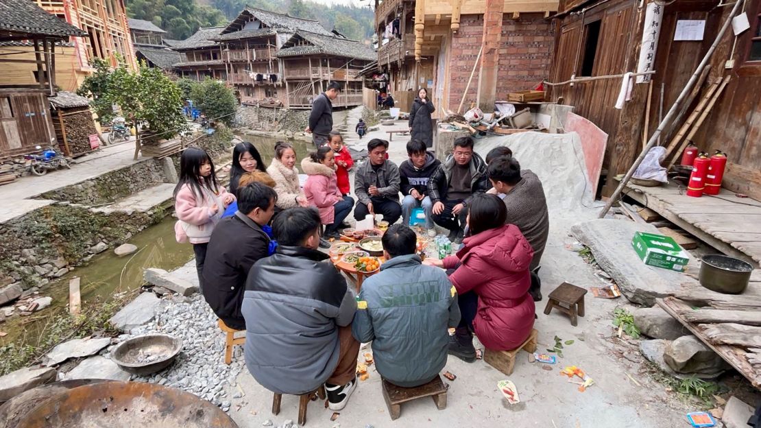 Dali villagers gather around a short table for their Lunar New Year feast.