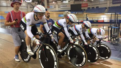 Kelly, left, in the the LA velodrome just before departing for Rio and the Olympics. The team is practicing starts. 