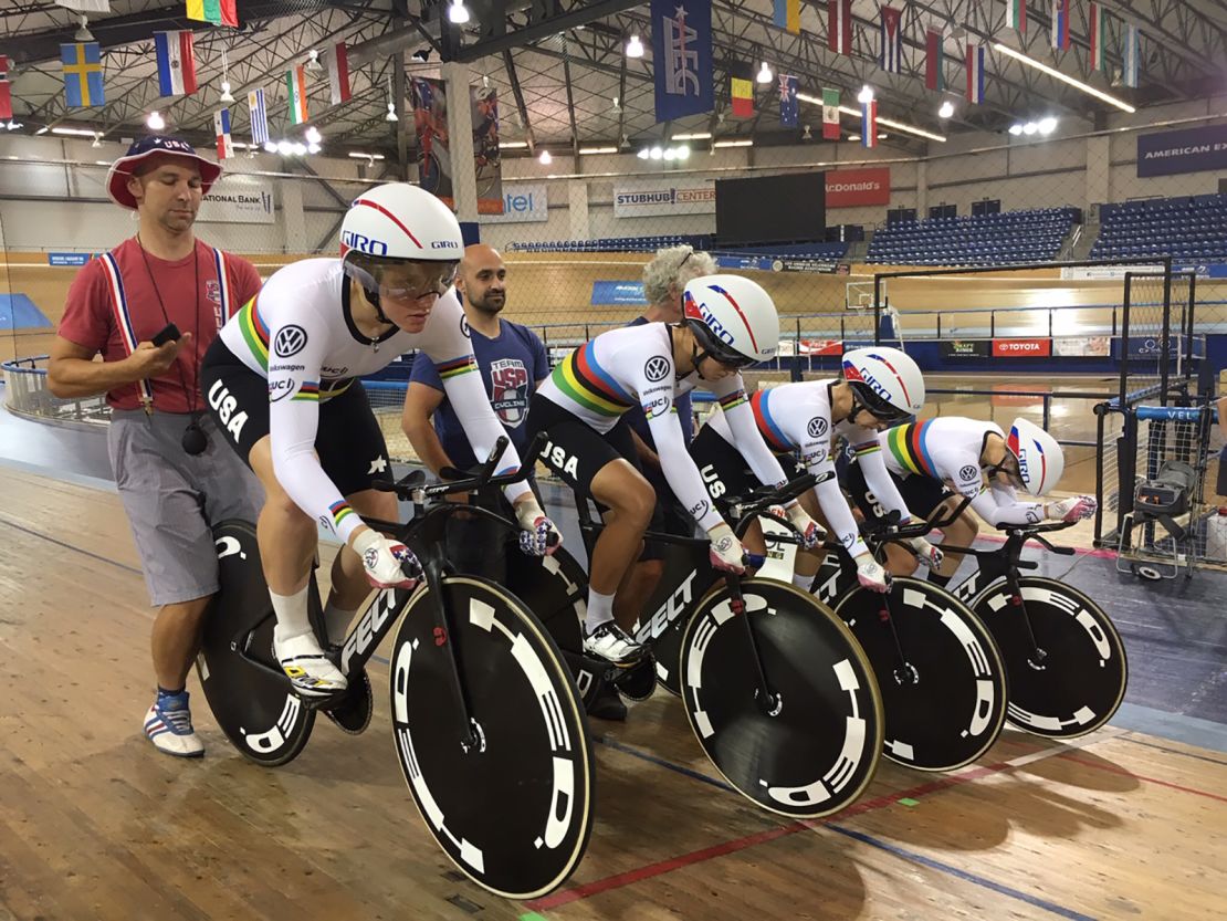 Kelly, left, in the the LA velodrome just before departing for Rio and the Olympics. The team is practicing starts. 