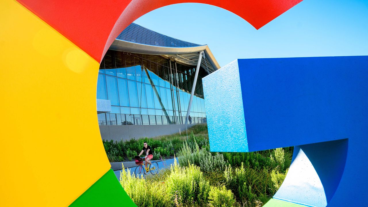 A bicyclist rides along a path at Google's Bay View campus in Mountain View, California on June 27, 2022. 
