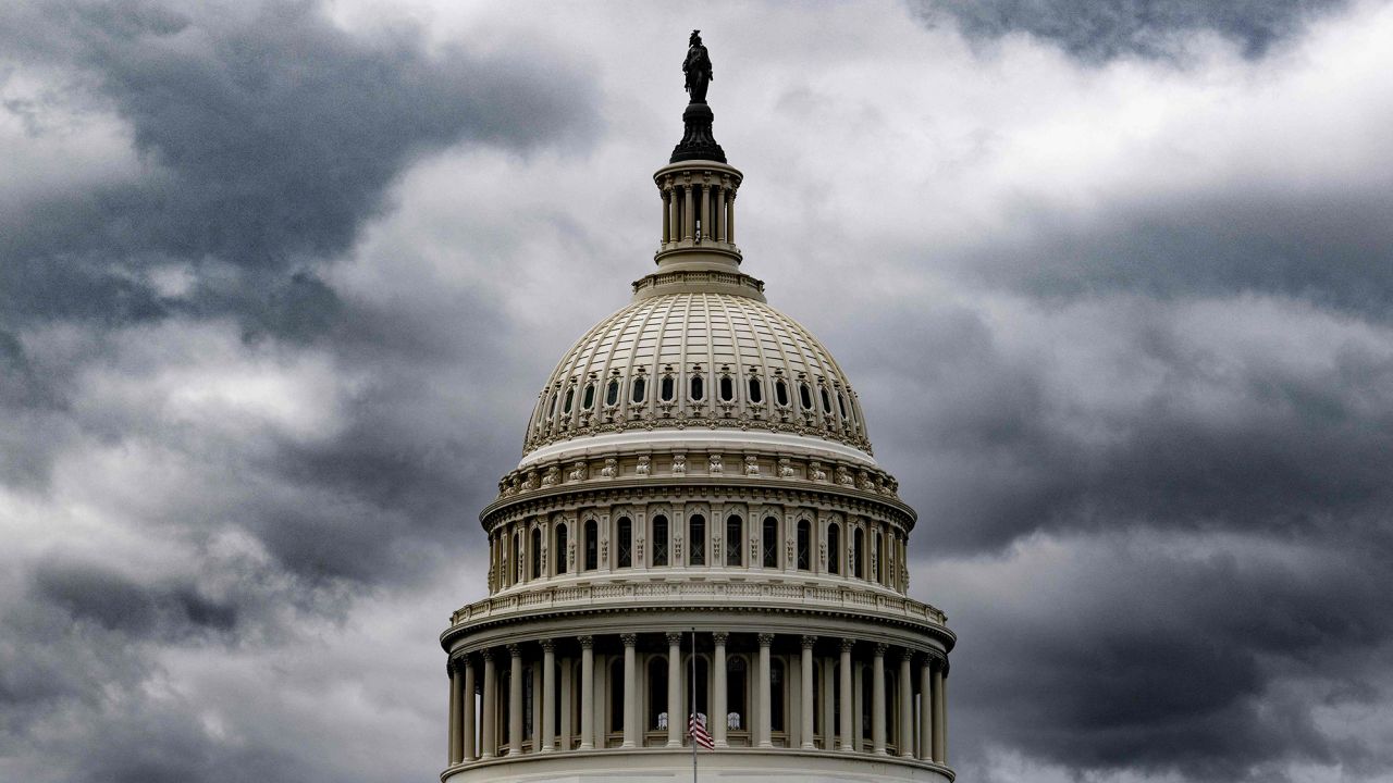 Storm clouds pass over the US Capitol in Washington, DC, on January 23, 2023. 