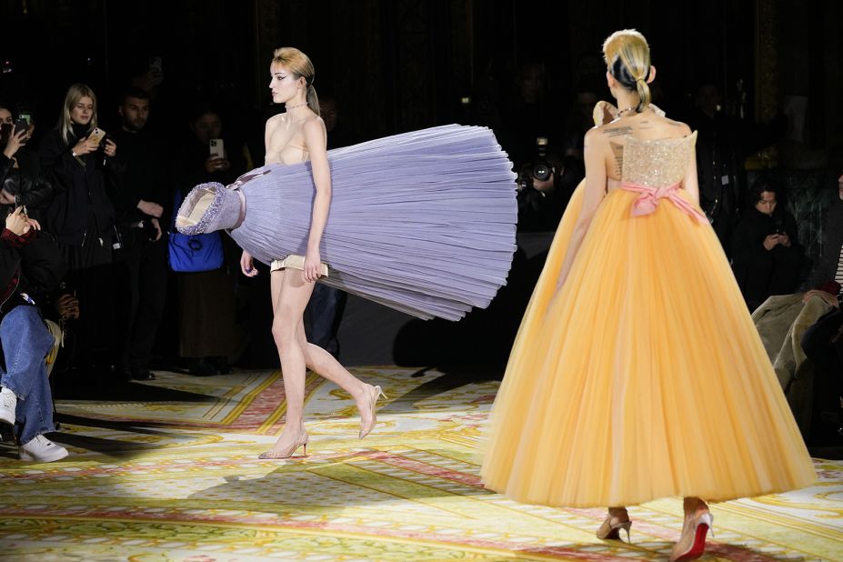 Models wore ballgowns positioned in multiple directions. 