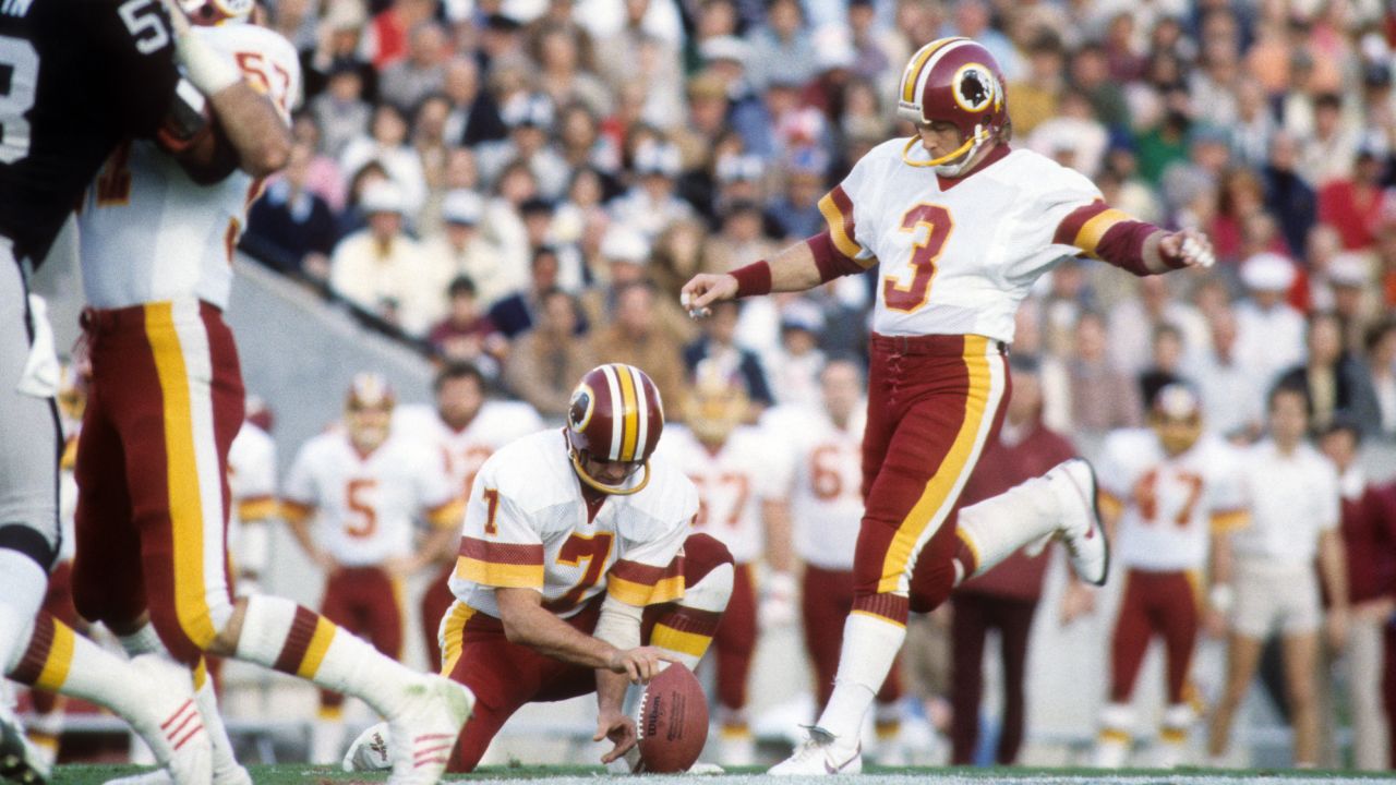 Moseley kicks against the Los Angeles Raiders during Super Bowl XVIII.