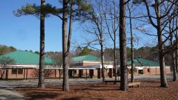 NEWPORT NEWS, VA - JANUARY 07: Tall pine trees outside Richneck Elementary School on January 7, 2023 in Newport News, Virginia. A 6-year-old student is in custody following a shooting involving a female teacher, who was shot in the chest, is in critical condition according to police reports. (Photo by Jay Paul/Getty Images)