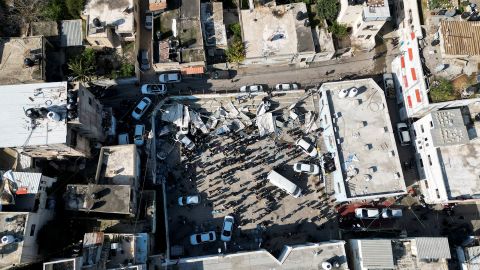 Palestinians inspect the damage following an Israeli strike in Jenin on January 26, 2023.