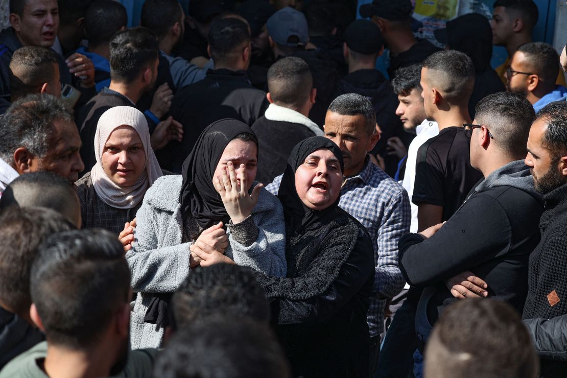 Family members of one of the Palestinian people killed during the Israeli raid on January 26, 2023 mourn his death during his funeral procession in Jenin.