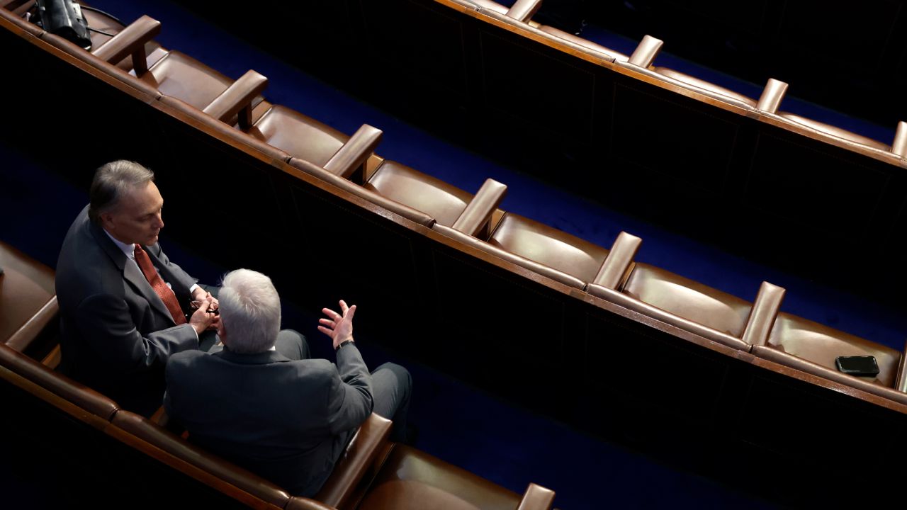 Rep. Andy Biggs and Republican Whip Tom Emmer negotiate in the House Chamber during the fourth day of elections for Speaker of the House at the U.S. Capitol Building on January 6, 2023 in Washington, DC.