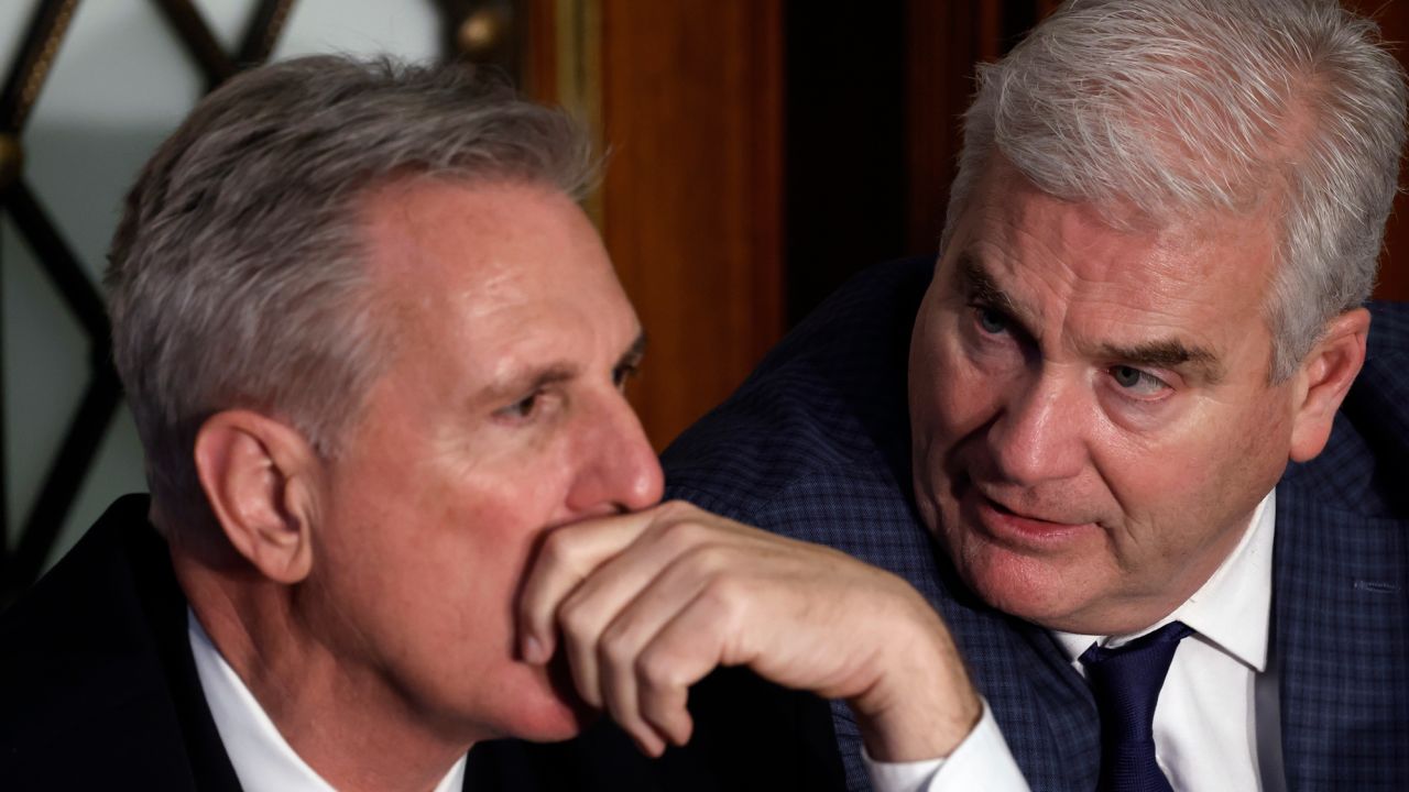 House Republican Leader Kevin McCarthy talks to Tom Emmer in the House Chamber during the second day of elections for speaker of the House at the US Capitol Building on January 4 in Washington, DC. 