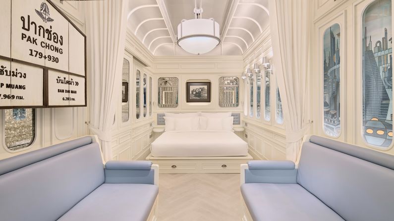 <strong>King Classic Lake View Room: </strong>Each room, designed to look like a classic railcar, features dramatic paneling with scenic wallpaper. 