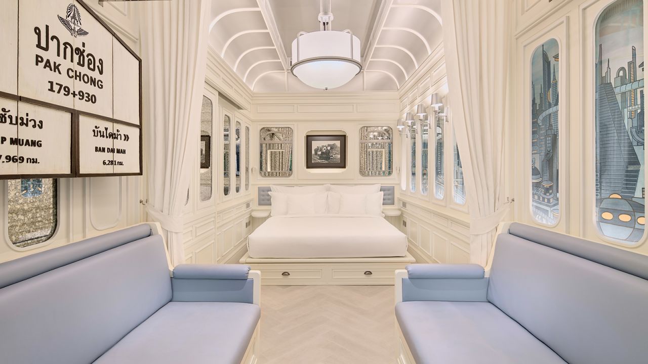 <strong>King Classic Lake View Room: </strong>Each room, designed to look like a classic railcar, features dramatic paneling with scenic wallpaper. 