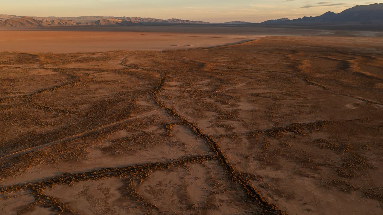 So-called giant desiccation cracks are seen near Red Lake, north of Kingman. These cracks form as underground water that supports the land is depleted.