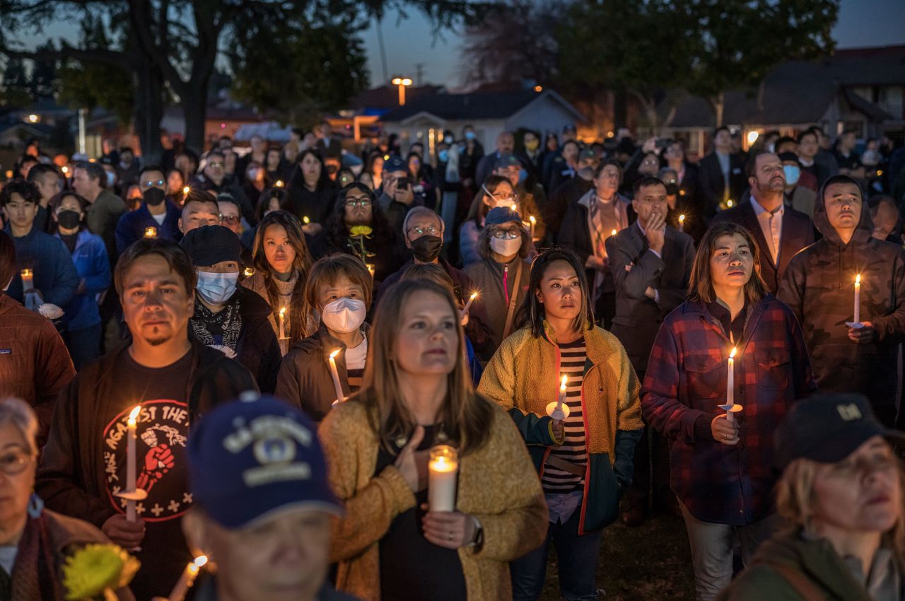 People gather at the Monterey Park City Hall for a candlelight vigil on Tuesday, January 24. They were remembering <a href=