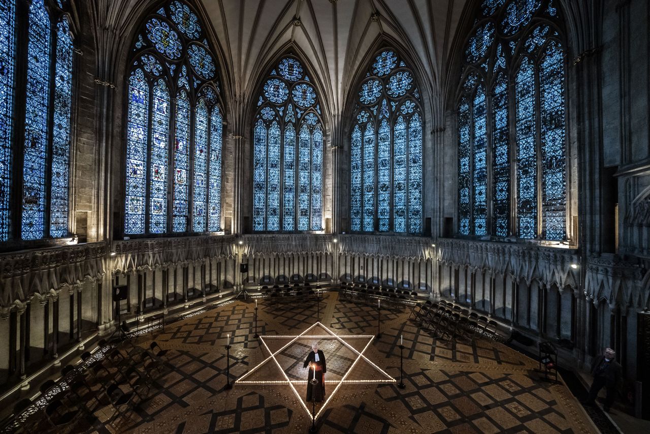 The Rev. Canon Maggie McLean helps light 600 candles in the shape of the Star of David during an event in York, England, marking International Holocaust Day on Wednesday, January 25. The 600 handles were lit in the memory of the more than 6 million Jewish people who were murdered in the Holocaust.