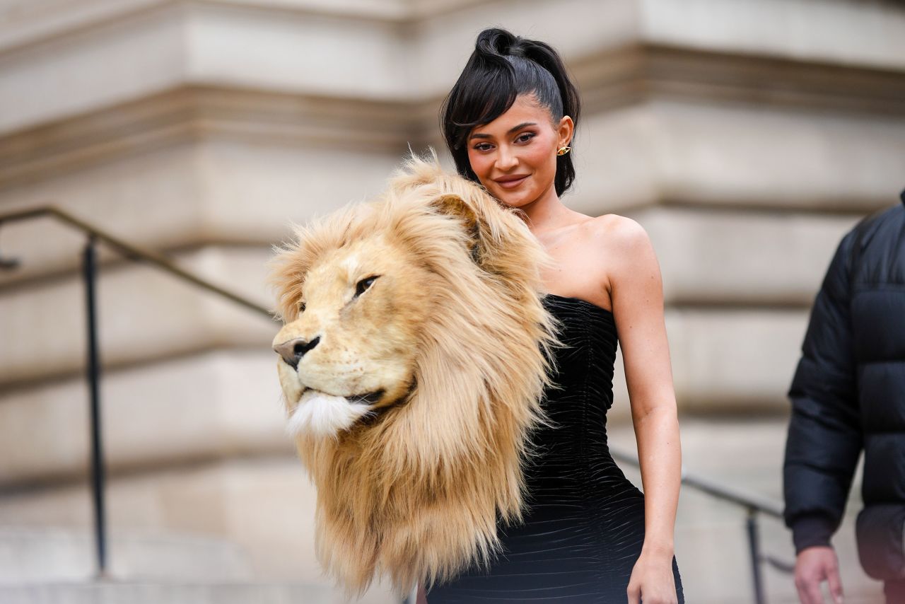 Kylie Jenner wears a strapless gown <a href="https://www.cnn.com/style/article/kylie-jenner-lion-head-dress-schiaparelli-haute-couture-week/index.html" target="_blank">adorned with a faux lion's head</a> as she arrives for a Schiaparelli couture show in Paris on Monday, January 23.