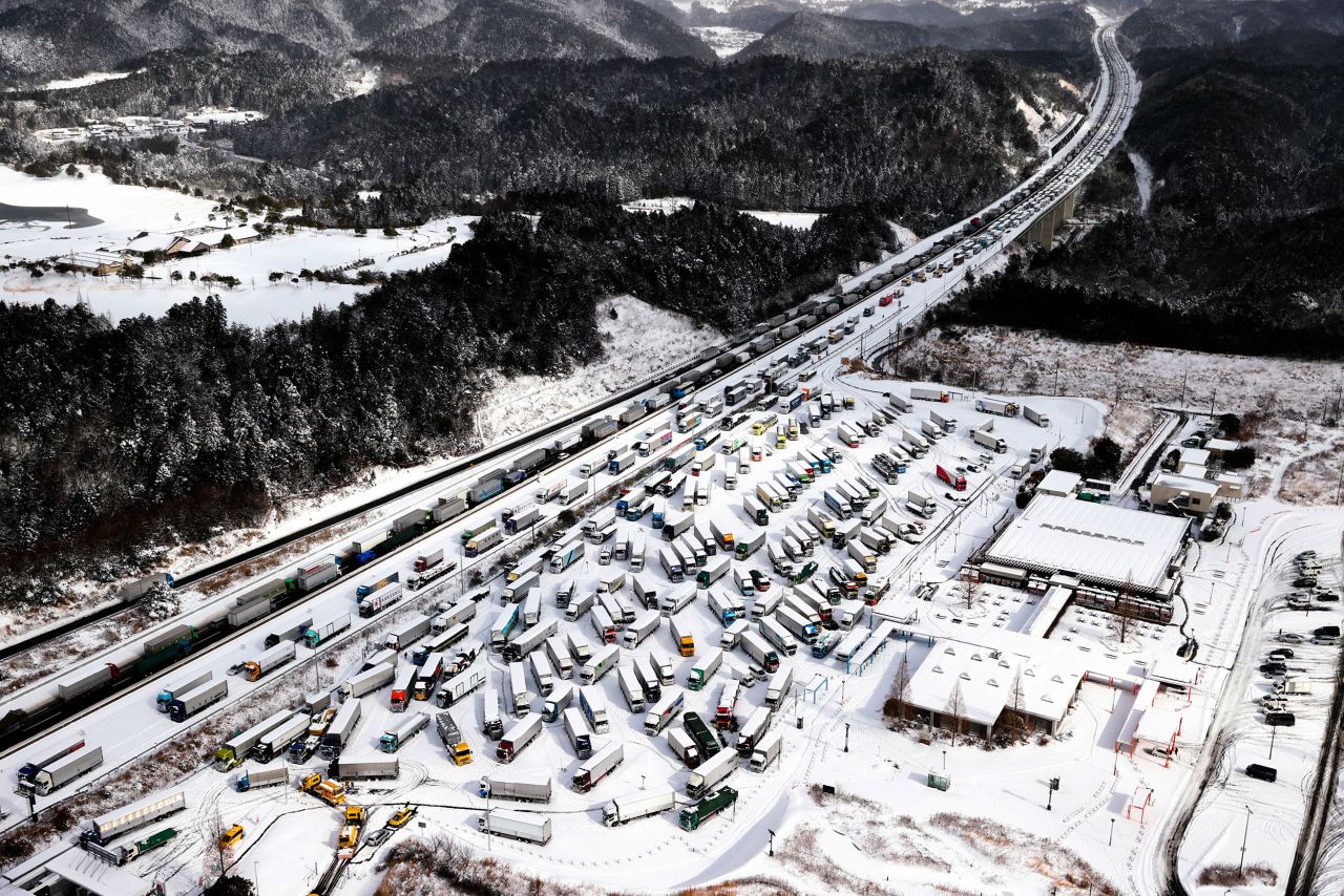 Vehicles are stranded on the Shin-Meishin Expressway after heavy snow in Koka, Japan, on Wednesday, January 25.
