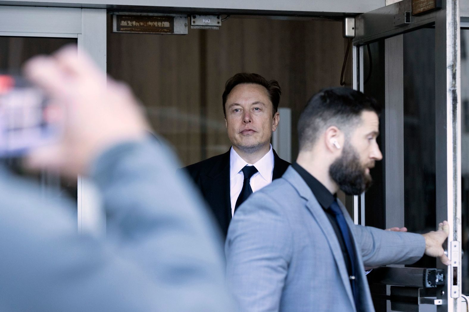 Tesla CEO Elon Musk leaves a federal courthouse in San Francisco on Tuesday, January 24. Musk, Tesla and company directors <a href="index.php?page=&url=https%3A%2F%2Fwww.cnn.com%2F2023%2F01%2F23%2Fbusiness%2Ftesla-trial-funding-secured-elon-musk%2Findex.html" target="_blank">are facing a shareholder lawsuit</a> over a 2018 tweet in which Musk said that he was thinking about taking Tesla private for $420 a share and had "funding secured." Those two words resulted in the CEO having to forfeit his position as Tesla's executive chairman and pay millions of dollars in fines and legal fees. 