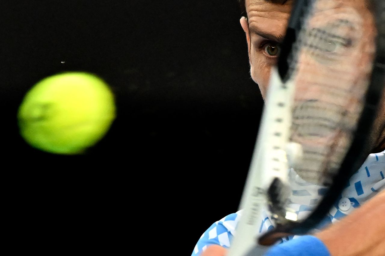 Novak Djokovic hits a return during a quarterfinal match at the Australian Open on Wednesday, January 25. He is seeking his 10th Australian Open title and his 22nd Grand Slam victory.