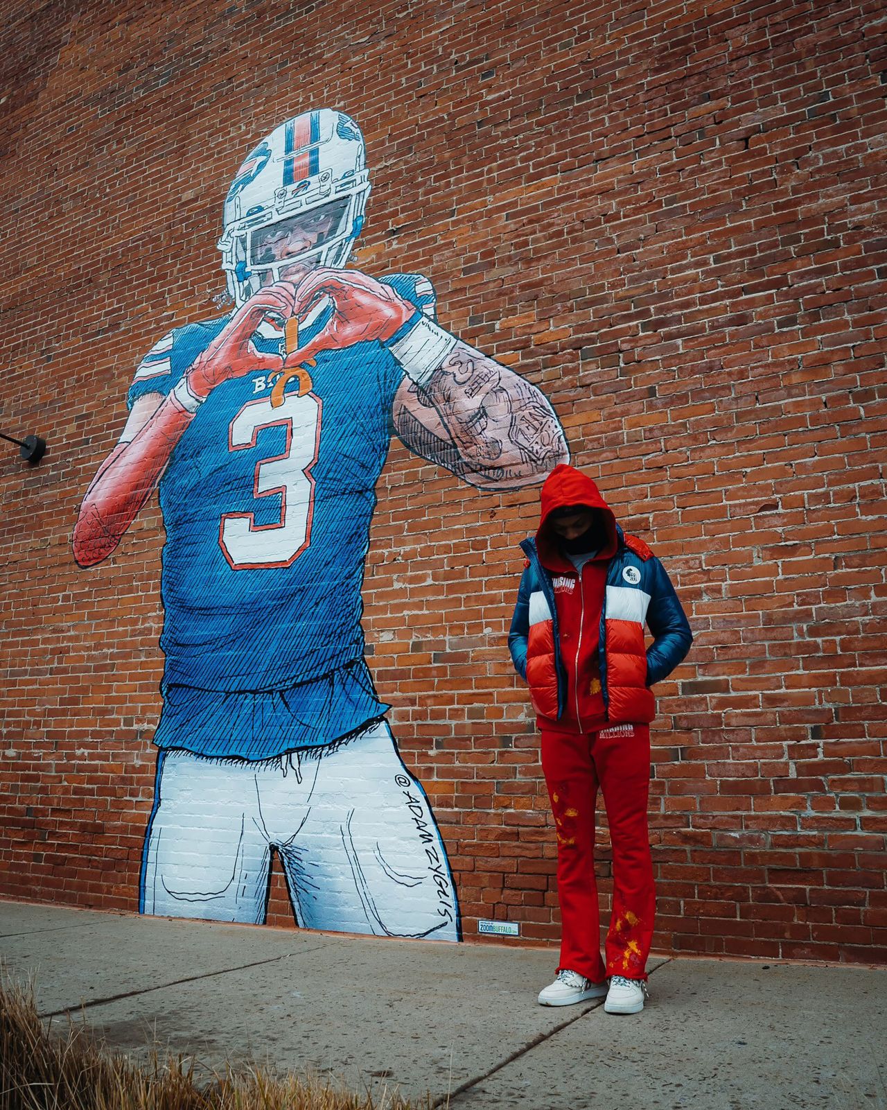 NFL football player Damar Hamlin <a href="https://twitter.com/HamlinIsland/status/1617678293876224002" target="_blank" target="_blank">tweeted this photo</a> of him standing in front of his mural in Buffalo, New York, on Monday, January 23. Hamlin suffered cardiac arrest and collapsed on the field during a game against Cincinnati on January 2.