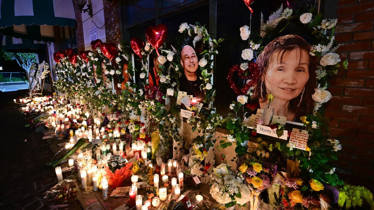 A makeshift memorial for victims of a mass shooting is pictured in front of the Star Ballroom Dance Studio in Monterey Park, California on January 26, 2023. 