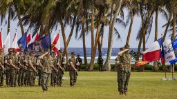 US Marines salute during the Marine Corps Base Camp Blaz Reactivation and Naming Ceremony at Asan Beach, National Historical Park, Asan, Guam, on Jan. 26, 2023.