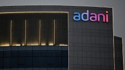 FILE PHOTO: The logo of the Adani Group is seen on the facade of one of its buildings on the outskirts of Ahmedabad, India, April 13, 2021. REUTERS/Amit Dave/File Photo