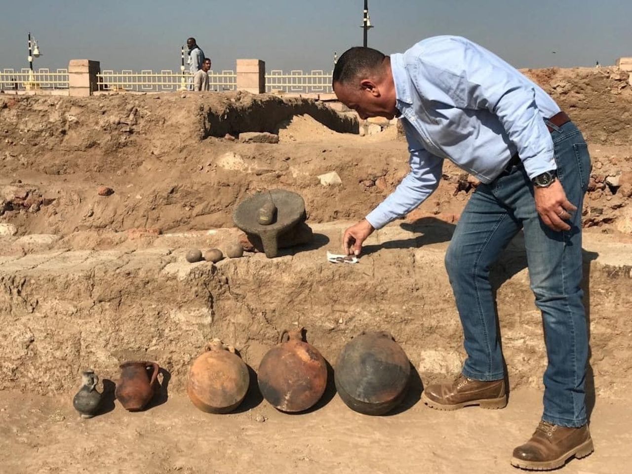The excavation unearthed a cache of ancient artifacts. 