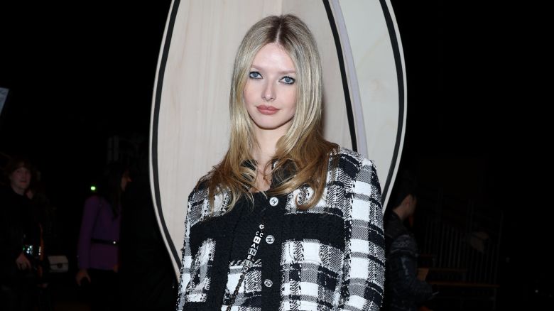 Martin wore a matching checked mini dress and cardigan from Chanel.